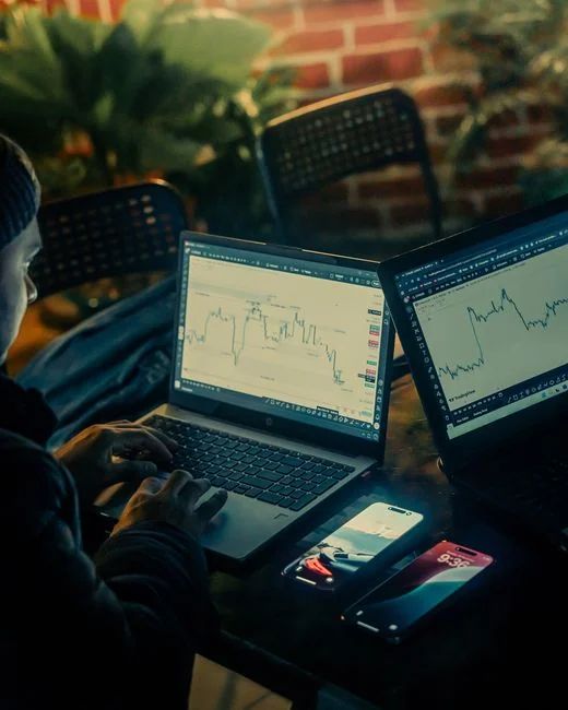 Close-up of a woman working on a digital marketing project in a home office setting.